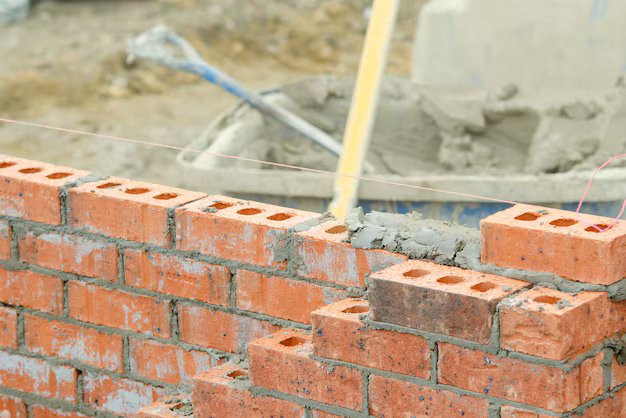 Home bricklayer laying bricks mortar new residential house construction 245726 1728